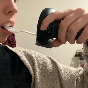 3D-printed spoon attached to a VR controller